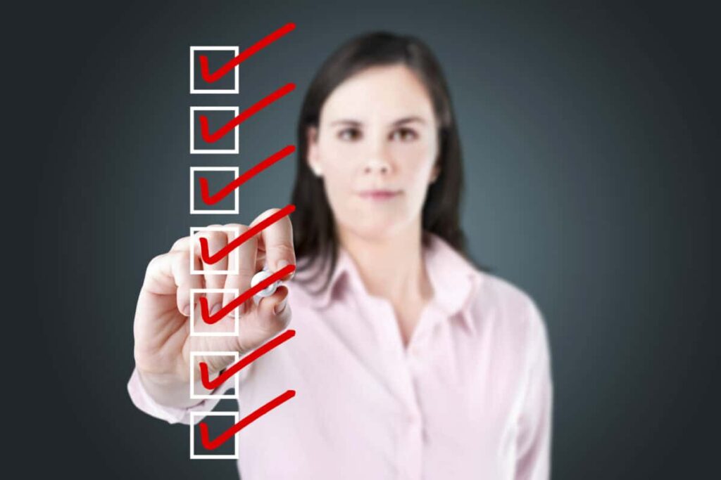 5 CRA Red Flags to Watch in Retirement Tax Returns woman checks off all the boxes