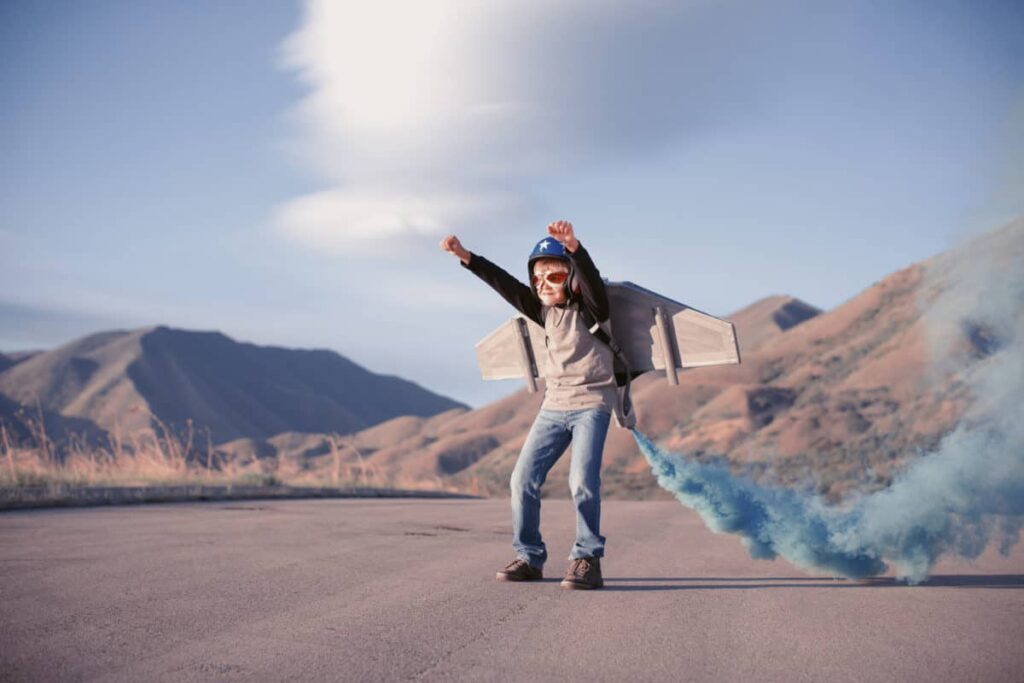 What the TFSA Fine Print Says About Holding U.S. Stocks A child pretends to blast off into space.
